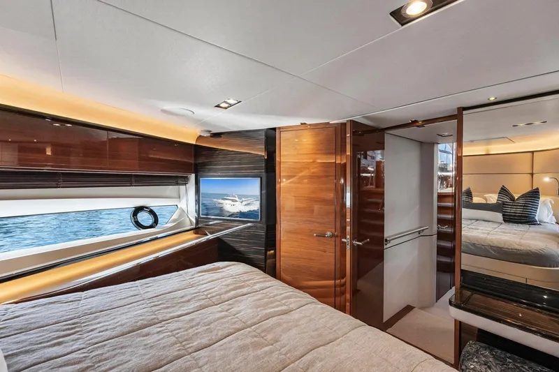 Slide: The Image of Luxurious interior of 2018 Princess Y75 yacht, featuring elegant wood finishes and modern design. - 36
