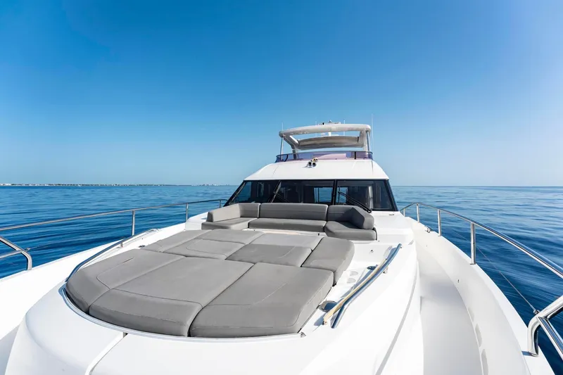 Slide: The Image of Luxurious 2018 Princess Y75 yacht on calm ocean, featuring spacious sun deck. - 68