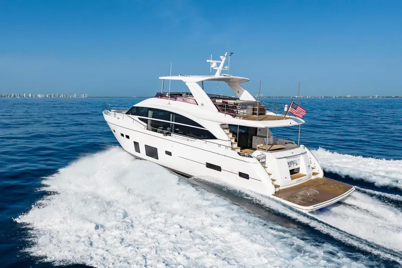 Slide: The Image of Luxurious 2018 Princess Y75 yacht cruising on open sea under clear blue sky. - 74