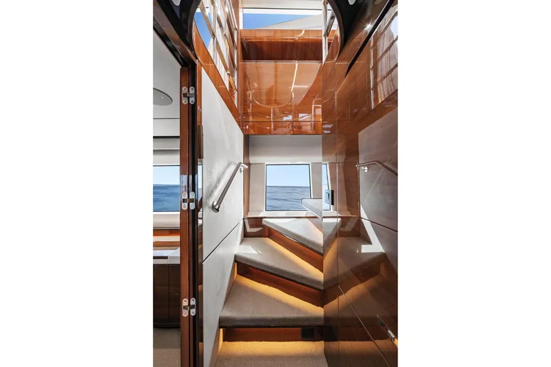 Slide: The Image of Luxurious interior staircase of 2018 Princess Y75 yacht with polished wood finish. - 23