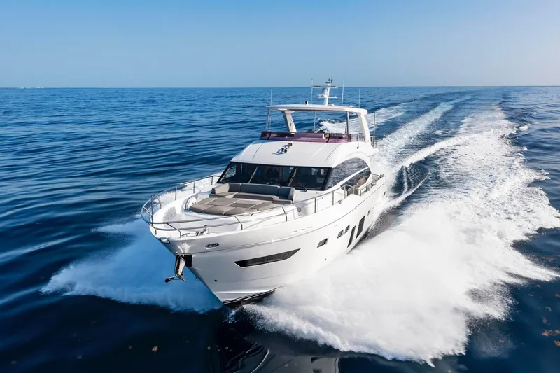 Slide: The Image of Luxurious 2018 Princess Y75 yacht cruising on open sea under clear blue sky. - 5