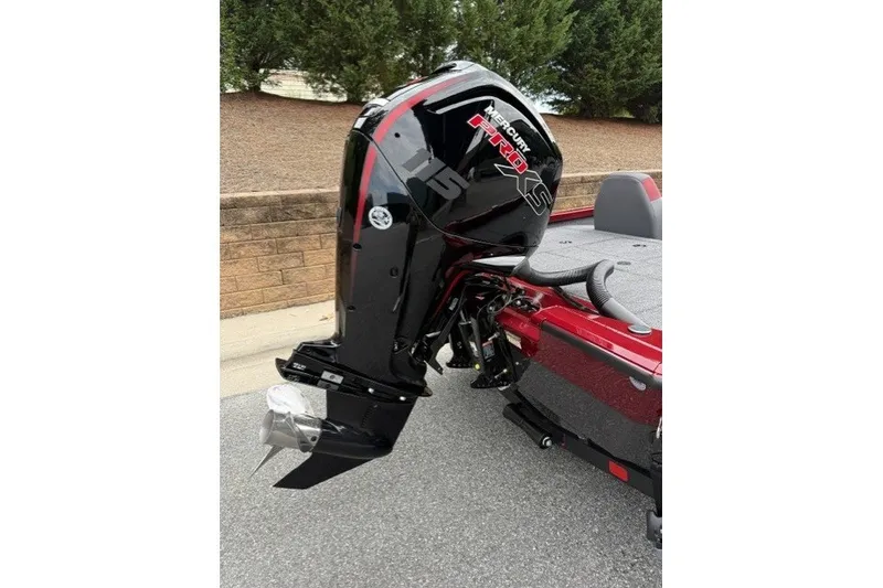 Slide: The Image of 2027 Vexus AVX1880 boat with Mercury Pro XS outboard motor, parked on pavement. - 3