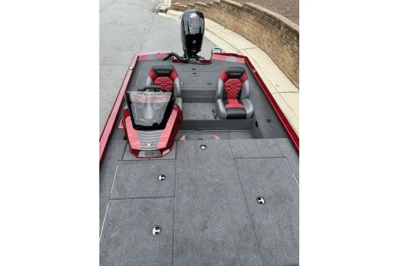 Slide: The Image of 2027 Vexus AVX1880 boat with red and gray seating, sleek design, and spacious deck. - 7