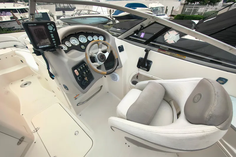 Slide: The Image of 2006 Stingray 250 LR boat cockpit with steering wheel and instrument panel. - 7