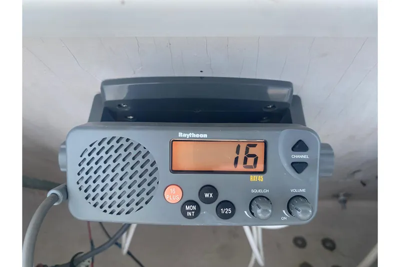 Slide: The Image of Raytheon marine radio on 1994 Robalo 2440 Walkaround boat, channel 16 displayed. - 10