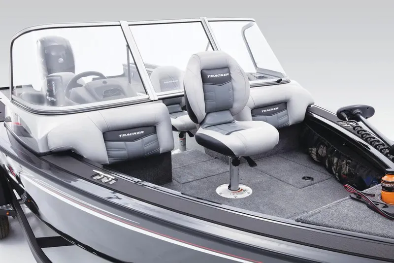 Slide: The Image of The image shows the cockpit of a 2017 Tracker Targa V-18 WT boat with gray seats. - 27