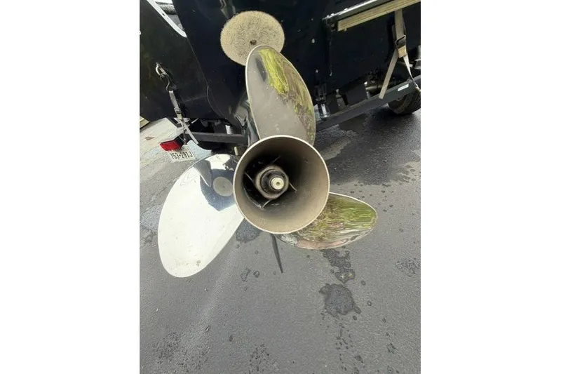 Slide: The Image of Propeller of 2017 Tracker Targa V-18 WT boat on pavement background. - 11