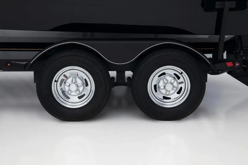 Slide: The Image of Close-up of a boat trailer with two wheels on a glossy floor. - 21