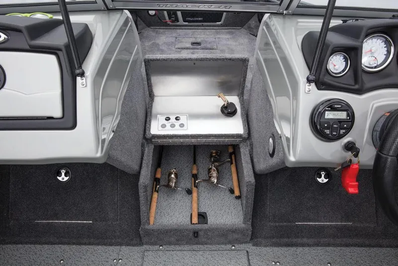 Slide: The Image of The image shows the interior of a Tracker Targa V-18 WT boat with fishing rod holders. - 42