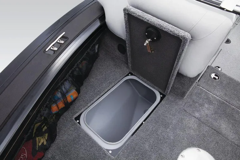 Slide: The Image of The image shows the interior of a 2017 Tracker Targa V-18 WT with an open storage compartment. - 33