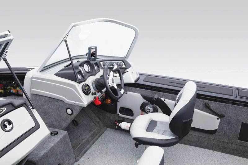 Slide: The Image of The image shows the cockpit of a 2017 Tracker Targa V-18 WT with gray seats and dashboard. - 30