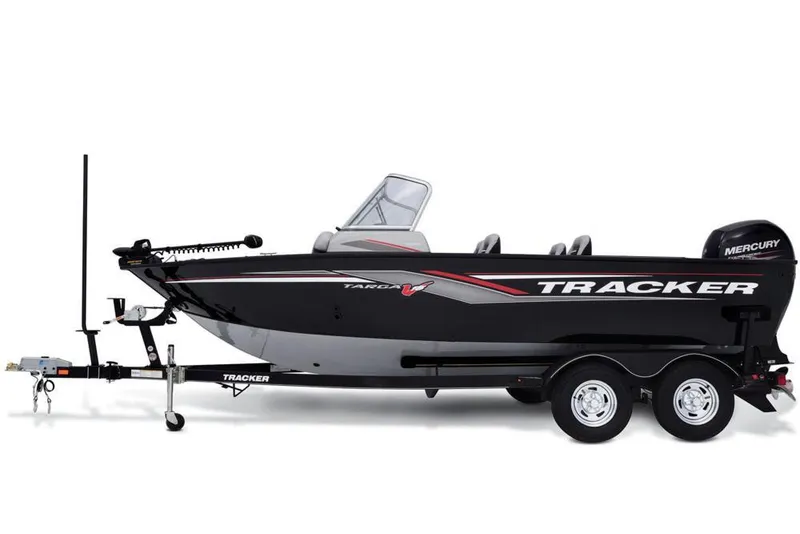 Slide: The Image of 2017 Tracker Targa V-18 WT boat with a black hull, mounted on a trailer. - 22
