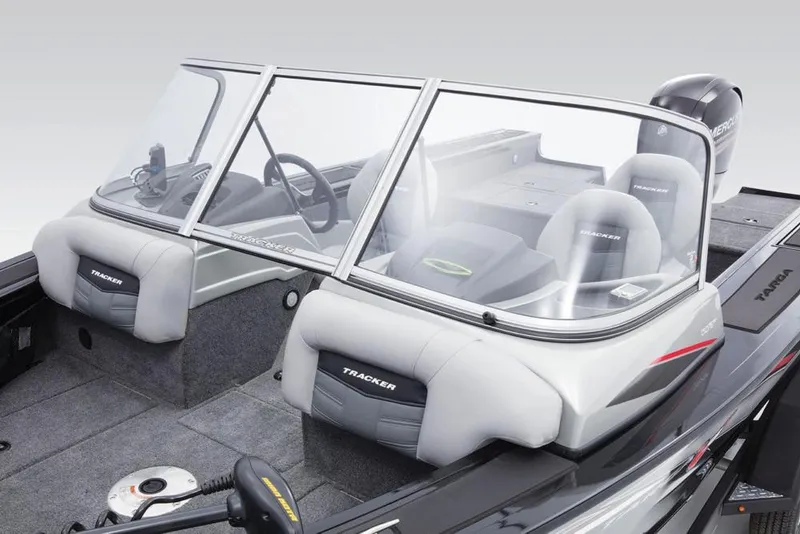 Slide: The Image of The image shows the cockpit of a 2017 Tracker Targa V-18 WT boat with gray seats. - 26