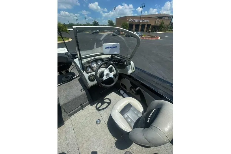 Slide: The Image of 2017 Tracker Targa V-18 WT boat interior with steering wheel and Lowrance equipment. - 8