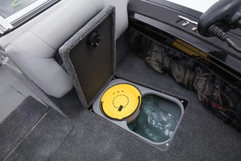 Slide: The Image of An open storage compartment on a boat with a yellow lid and water inside. - 34