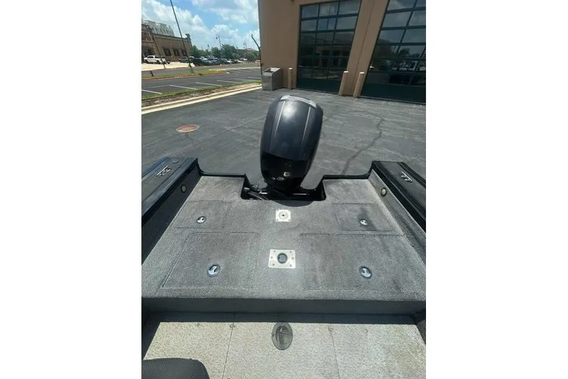 Slide: The Image of 2017 Tracker Targa V-18 WT boat with motor, parked outside a building. - 5