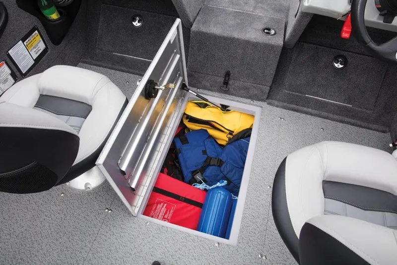 Slide: The Image of The image shows the interior of a 2017 Tracker Targa V-18 WT boat with an open storage compartment. - 41