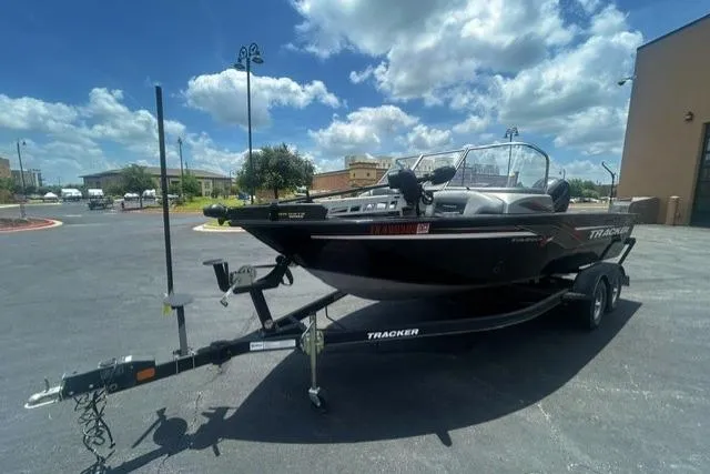 Slide: The Image of 2017 Tracker Targa V-18 WT boat on trailer under a bright blue sky. - 3