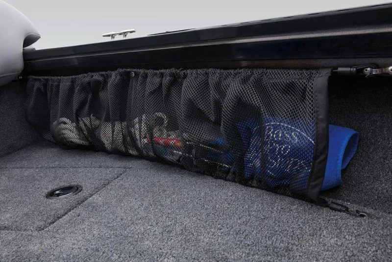 Slide: The Image of A netted compartment in the boat holds various items, including a blue cushion. - 37
