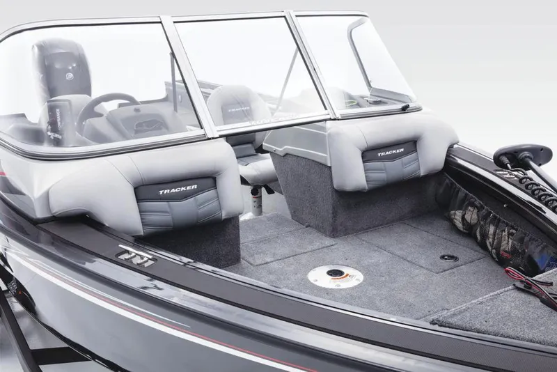 Slide: The Image of The image shows the cockpit of a 2017 Tracker Targa V-18 WT boat with gray seats. - 23