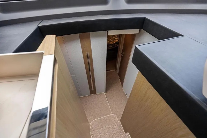 Slide: The Image of Interior view of 2022 Azimut Fly 50 yacht, featuring modern wood and carpeted stairs. - 43