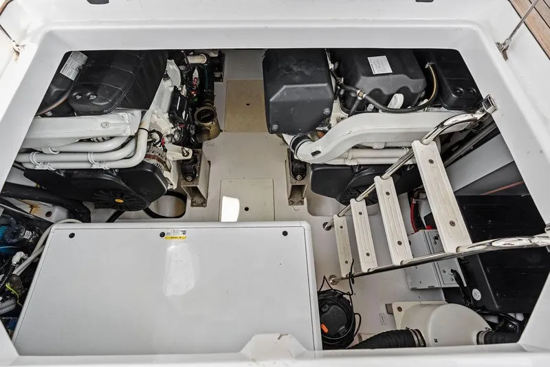 Slide: The Image of Engine compartment of 2022 Azimut Fly 50 yacht, showcasing dual engines and access ladder. - 55