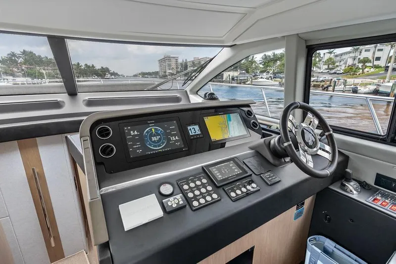 Slide: The Image of Cockpit of 2022 Azimut Fly 50 yacht with modern navigation controls and steering wheel. - 39
