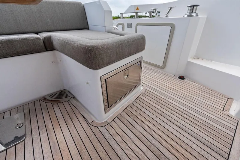 Slide: The Image of Azimut Fly 50 yacht interior, featuring sleek seating and elegant wood flooring, 2022 model. - 17