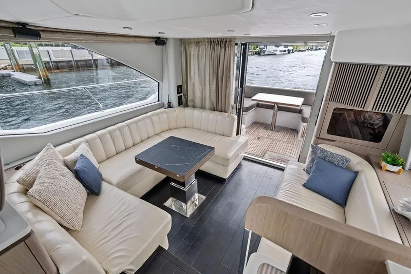 Slide: The Image of Luxurious interior of 2022 Azimut Fly 50 yacht with elegant seating and waterfront view. - 31