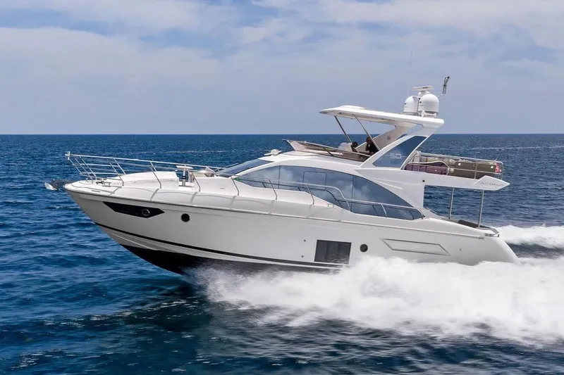 Slide: The Image of 2022 Azimut Fly 50 yacht cruising on open sea under clear skies. - 7