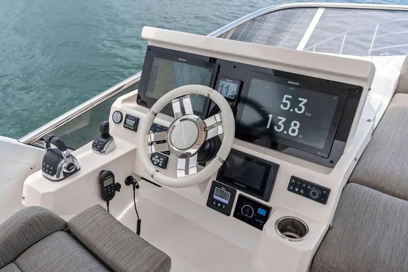 Slide: The Image of Cockpit of 2022 Azimut Fly 50 yacht with modern navigation displays and controls. - 24