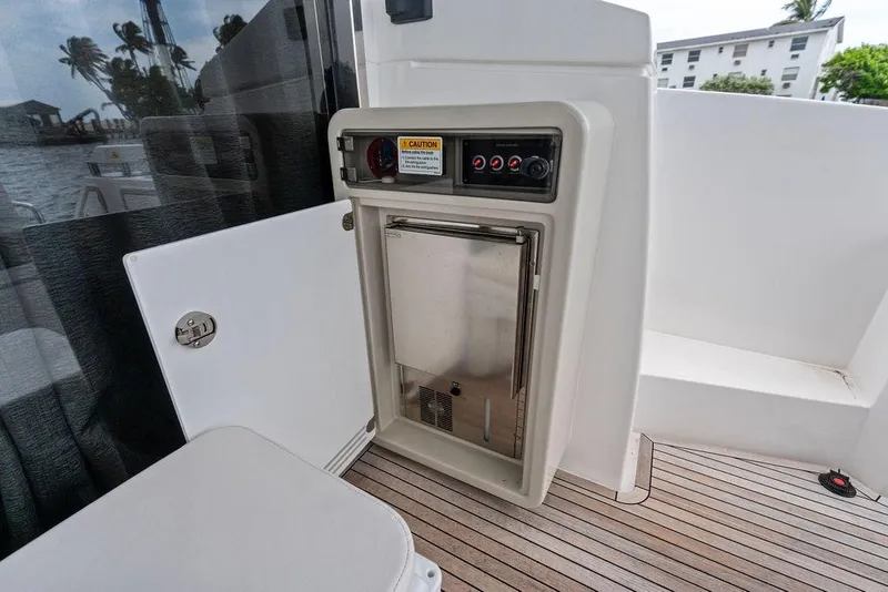Slide: The Image of Azimut Fly 50 yacht interior, featuring a compact stainless steel appliance, 2022 model. - 16