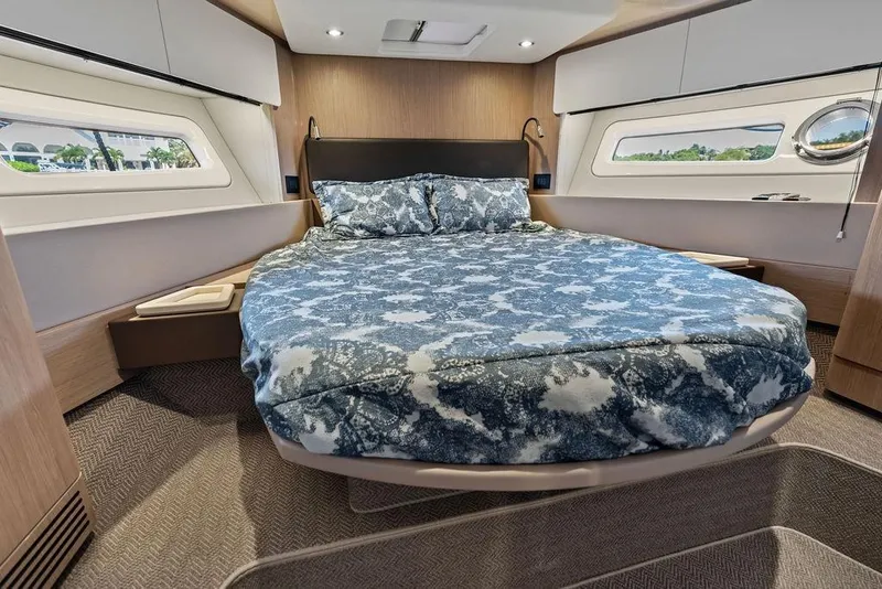 Slide: The Image of Luxurious bedroom interior of 2022 Azimut Fly 50 yacht with elegant bedding and modern design. - 53