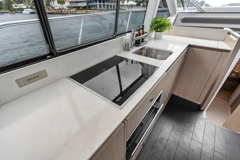 Slide: The Image of Modern kitchen interior on 2022 Azimut Fly 50 yacht with sleek countertops and appliances. - 36
