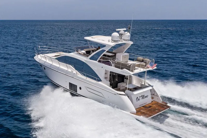 Slide: The Image of 2022 Azimut Fly 50 yacht cruising on open sea, rear view. - 6