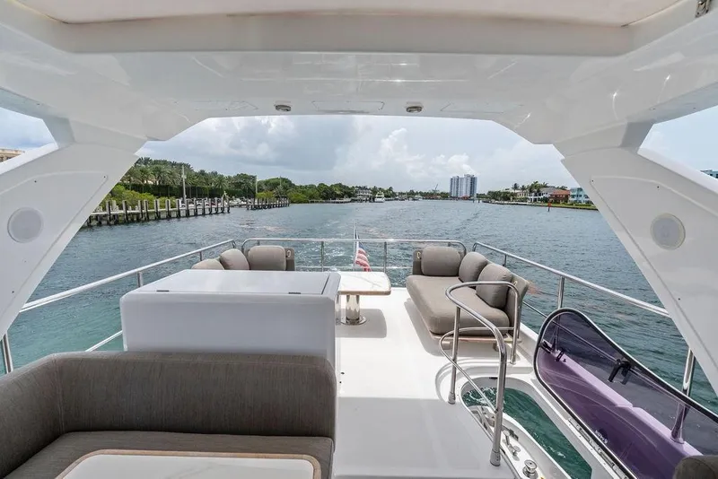 Slide: The Image of Luxurious 2022 Azimut Fly 50 yacht with spacious deck and scenic waterway view. - 30