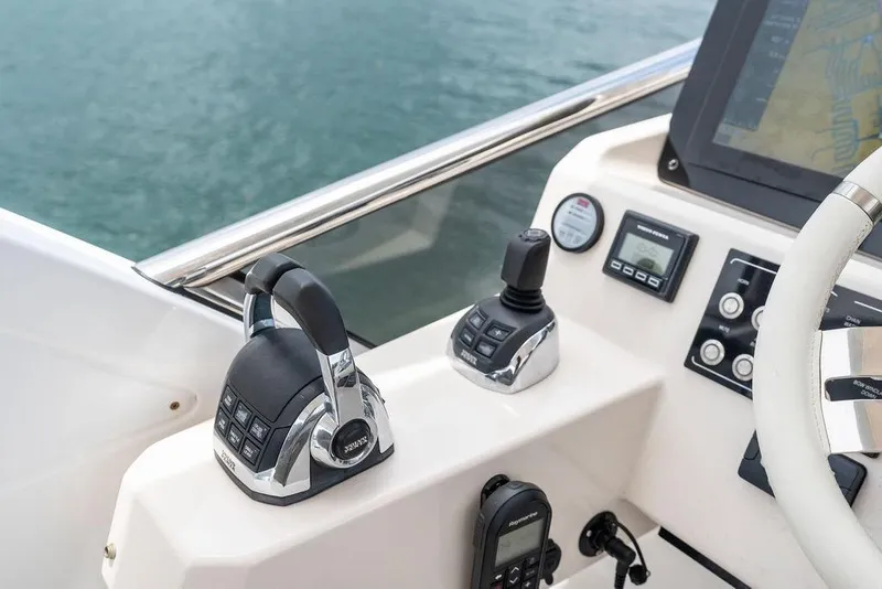 Slide: The Image of Control panel of 2022 Azimut Fly 50 yacht with navigation and throttle systems. - 26