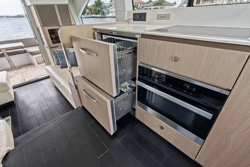 Slide: The Image of Modern kitchen interior of 2022 Azimut Fly 50 yacht with open drawers and appliances. - 35