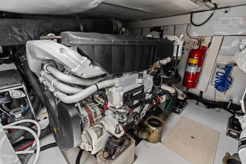 Slide: The Image of Engine room of 2022 Azimut Fly 50 yacht, showcasing mechanical components and fire extinguisher. - 57