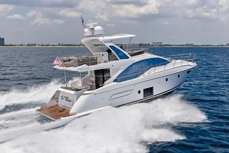 Slide: The Image of Azimut Fly 50 yacht cruising on open water, 2022 model, sleek design. - 10