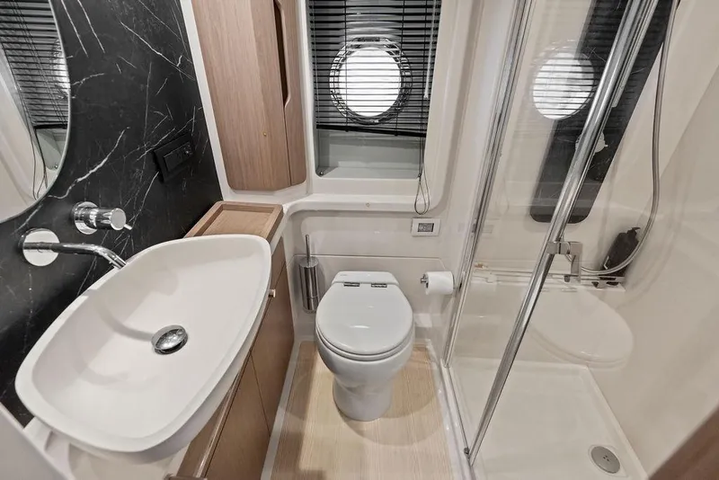 Slide: The Image of Luxurious bathroom in 2022 Azimut Fly 50 yacht with modern fixtures and elegant design. - 54