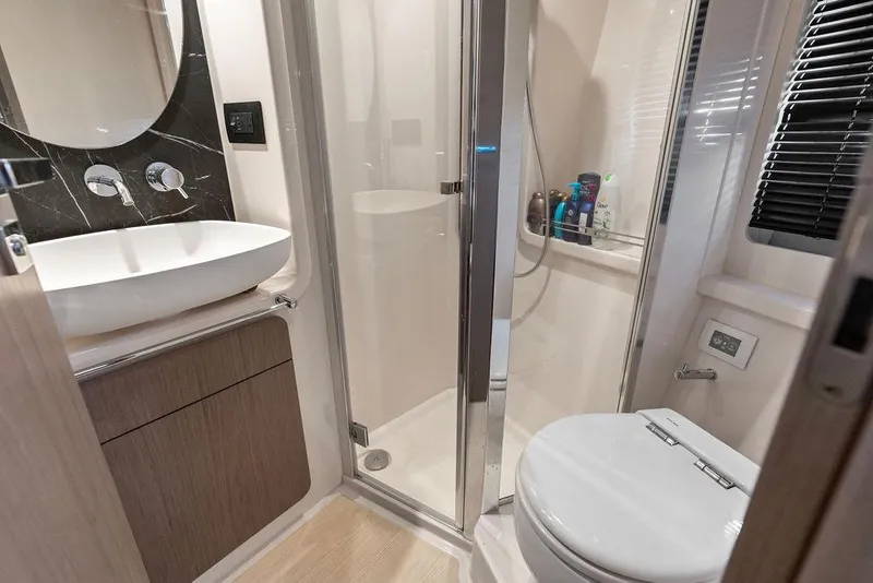 Slide: The Image of Luxurious bathroom in 2022 Azimut Fly 50 yacht with modern fixtures and shower. - 50
