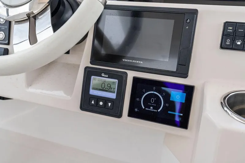 Slide: The Image of Control panel of 2022 Azimut Fly 50 yacht with steering wheel and digital displays. - 25
