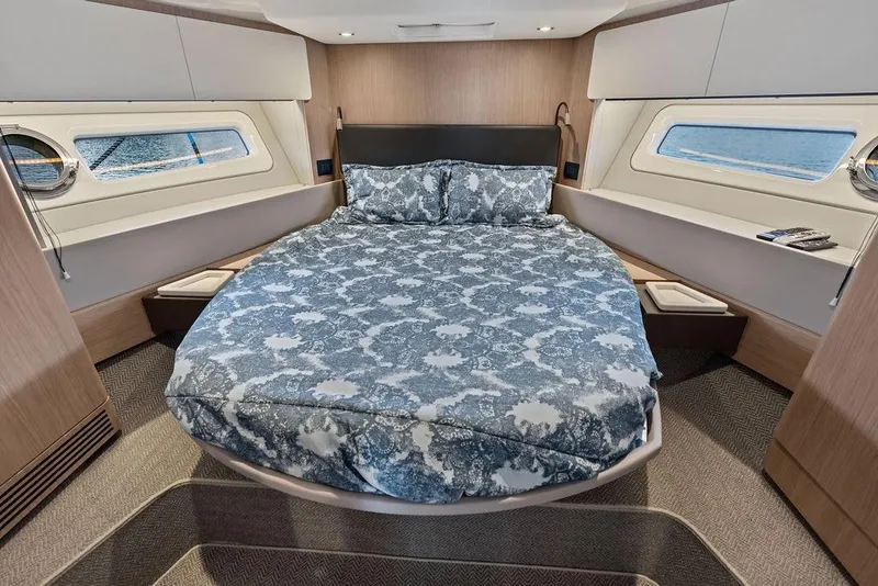 Slide: The Image of Luxurious bedroom interior of 2022 Azimut Fly 50 yacht with elegant bedding and ocean view. - 51