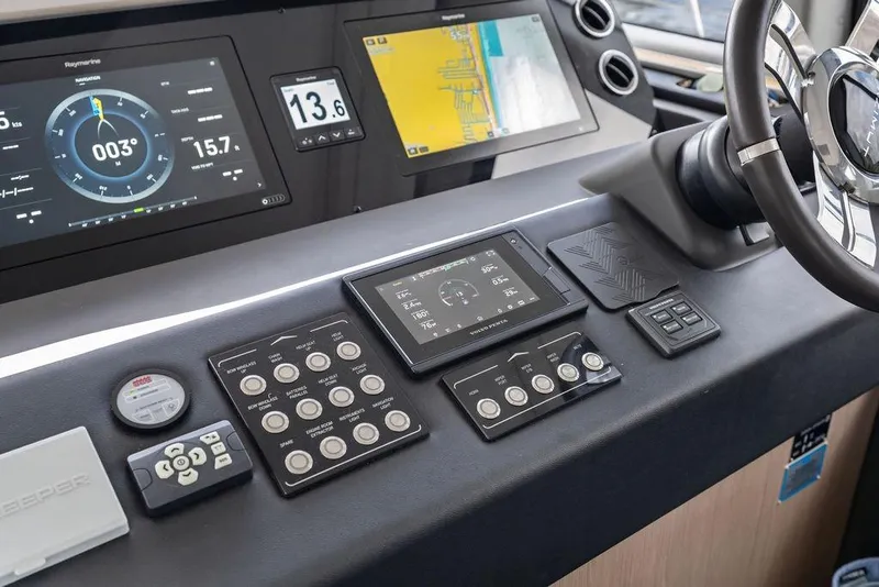 Slide: The Image of Control panel of 2022 Azimut Fly 50 yacht with advanced navigation displays and steering wheel. - 40
