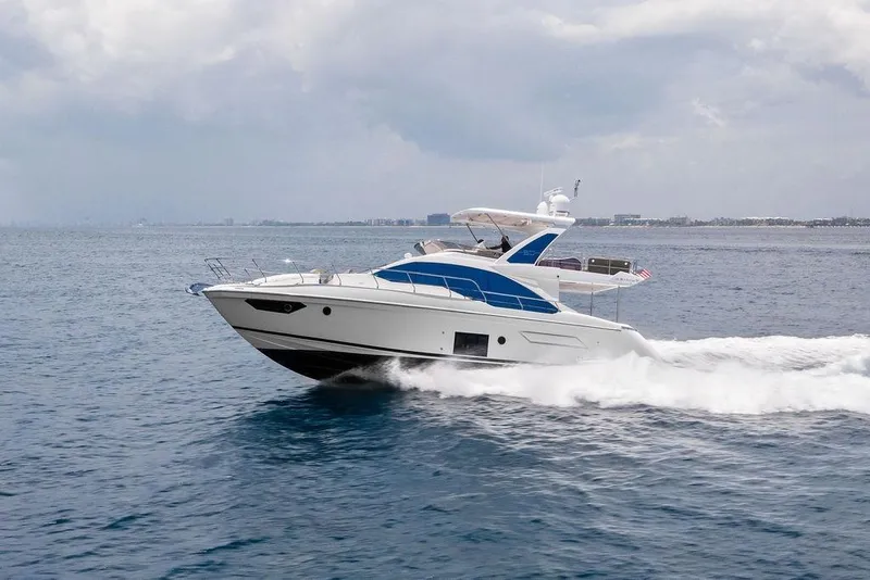 Slide: The Image of 2022 Azimut Fly 50 yacht cruising on open water under cloudy skies. - 8