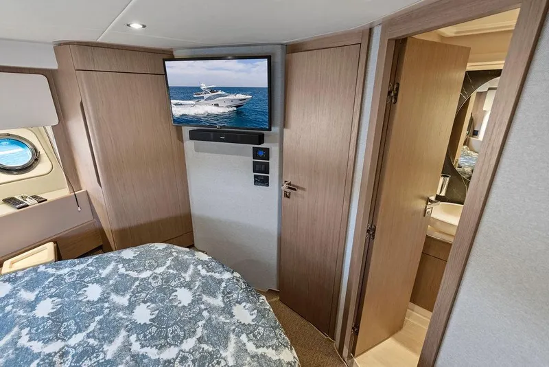 Slide: The Image of Luxurious interior of 2022 Azimut Fly 50 yacht with TV and elegant furnishings. - 52