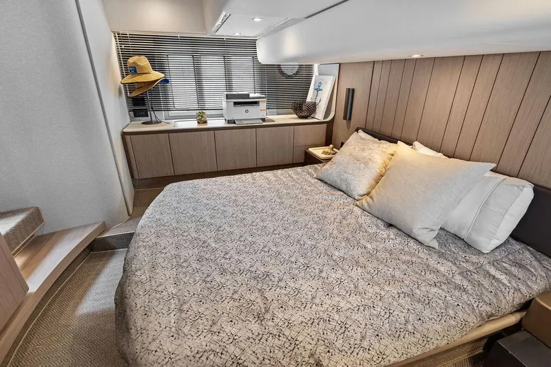 Slide: The Image of Luxurious bedroom interior of 2022 Azimut Fly 50 yacht with modern decor and cozy bedding. - 45