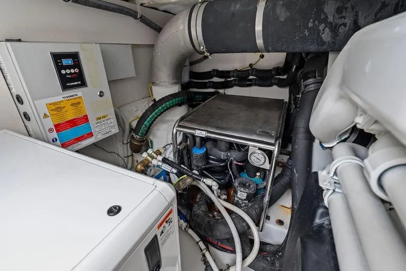 Slide: The Image of Engine room of 2022 Azimut Fly 50 yacht, featuring mechanical components and control systems. - 60