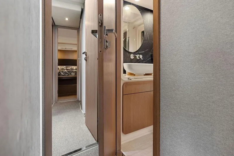 Slide: The Image of Interior view of 2022 Azimut Fly 50 yacht, featuring a modern bathroom and hallway. - 48